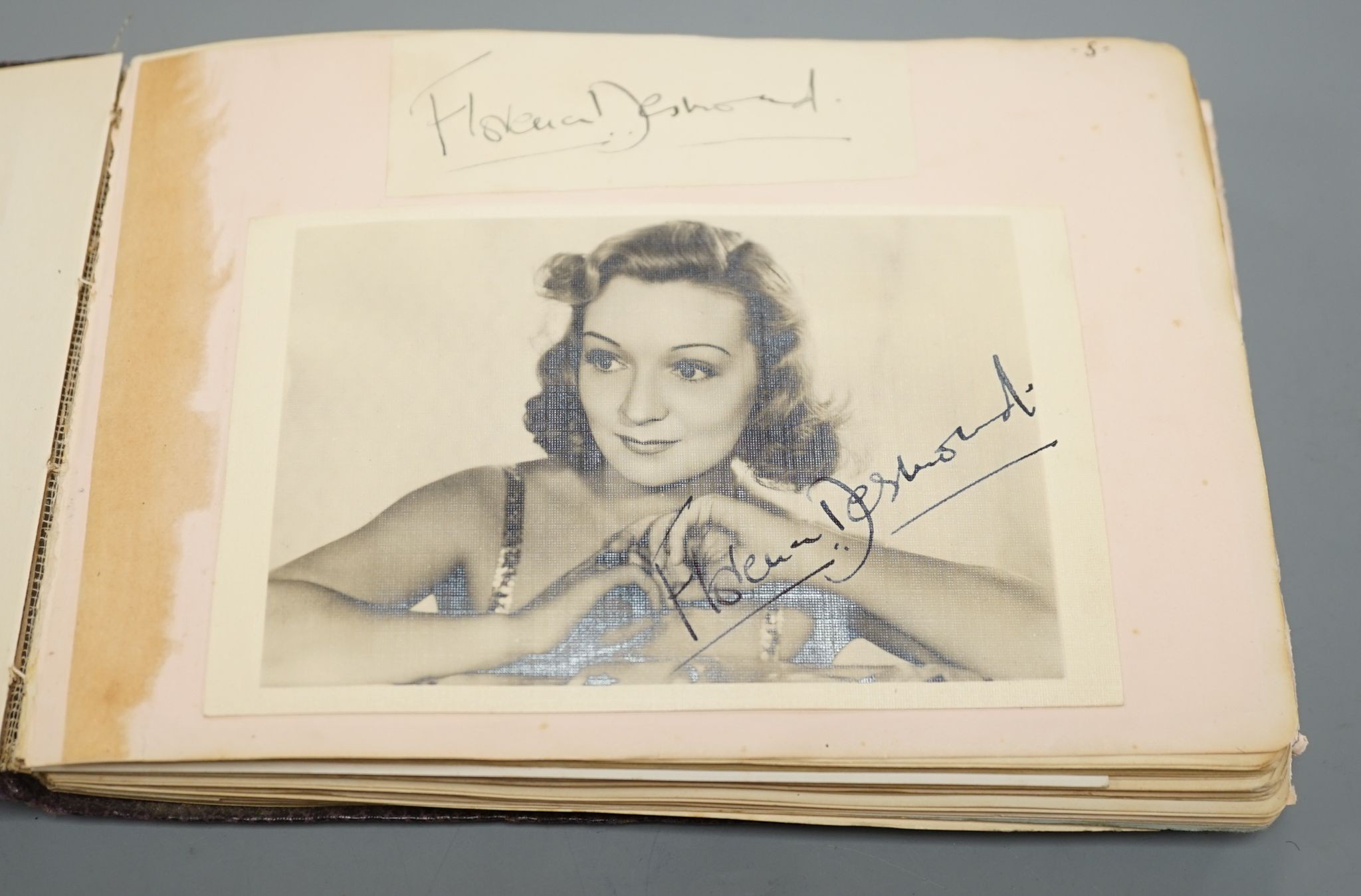 A 1930-40's autograph album including Judy Garland, Spencer Tracy, Basil Rathbone etc. and a photo album